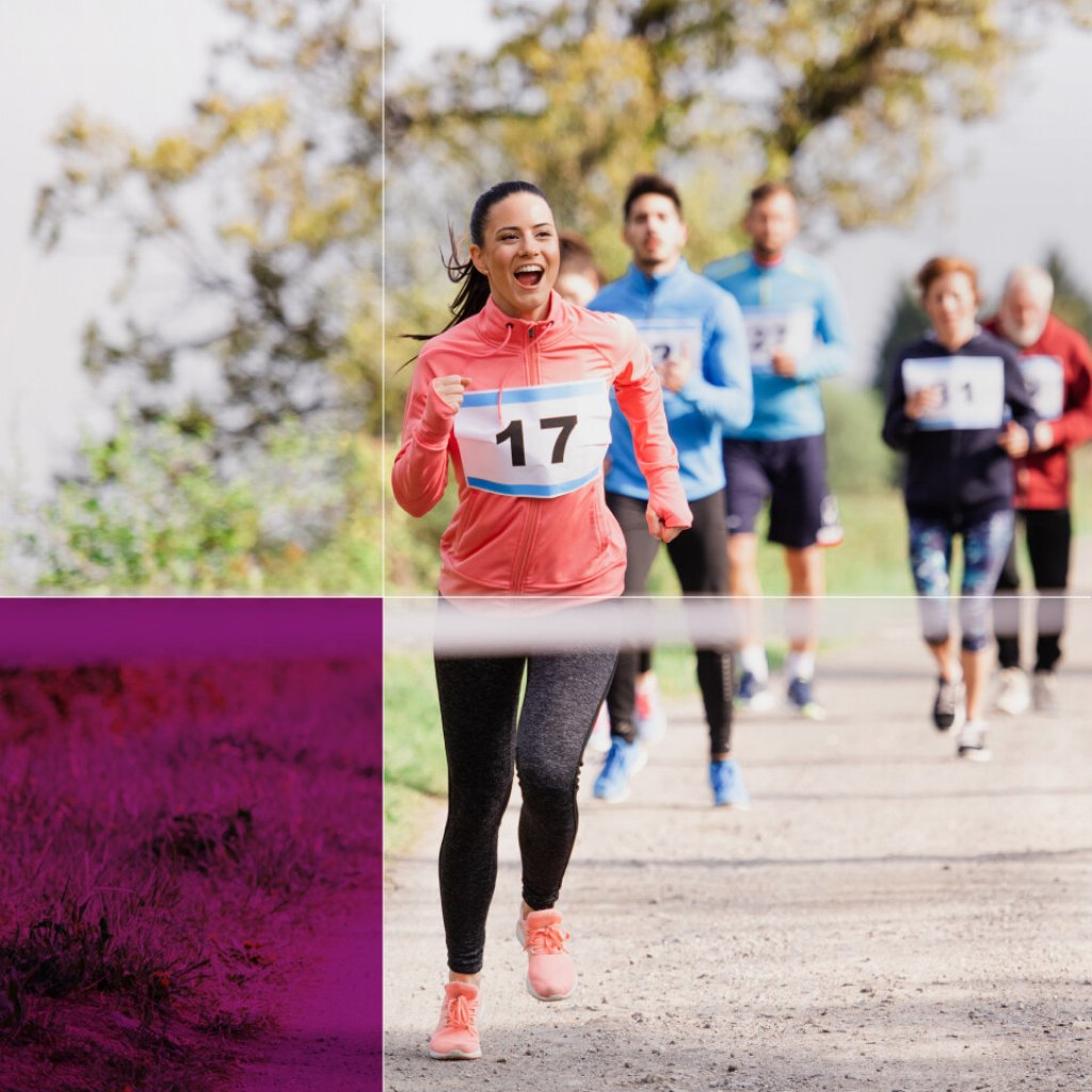 Runners in a fundraising event. A smiling woman leads the group.